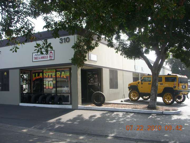 Preciado Tires storefront with custom yellow Hummer H2 — Pomona, CA
