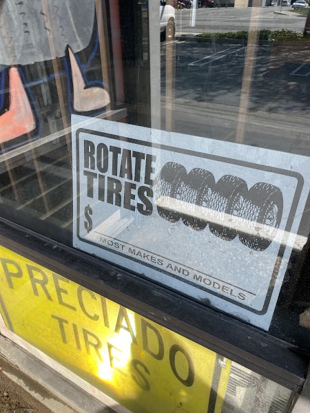 Preciado Tires signage with Smart Car